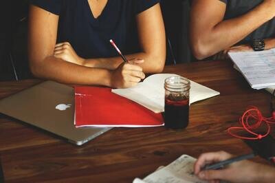 HRMS LMS integration -  woman with laptop